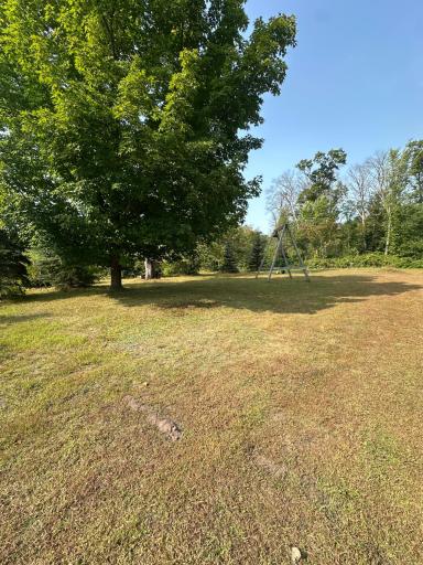 This property includes the solitude of a private drive and a wooded lot!