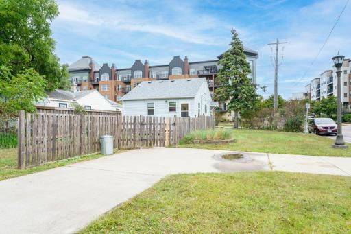 Back of Home with Concrete Drive and Parking Pad