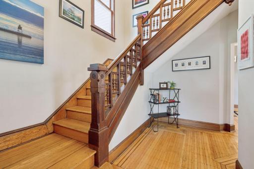 Lovely foyer and open staircase. Note the inlaid floors