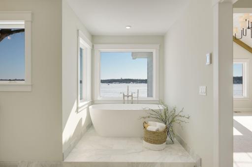 Primary bath with soaking tub - previously built home