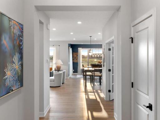 Foyer transitions into a hallway into the mudroom and flex room