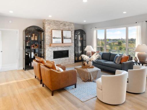 Gas fireplace is the focal point for this great room along with the stunning views.