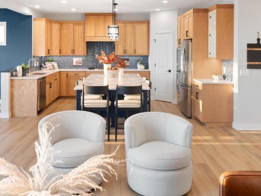 The warmth of the custom cabinets is shown nicely against the floors