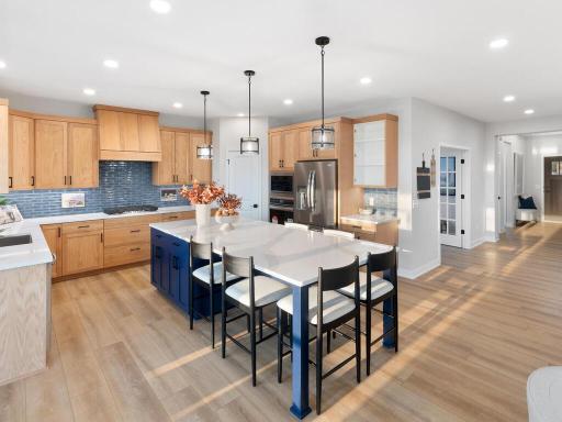 Under cabinet lighting accents the beautiful texture of blue tile