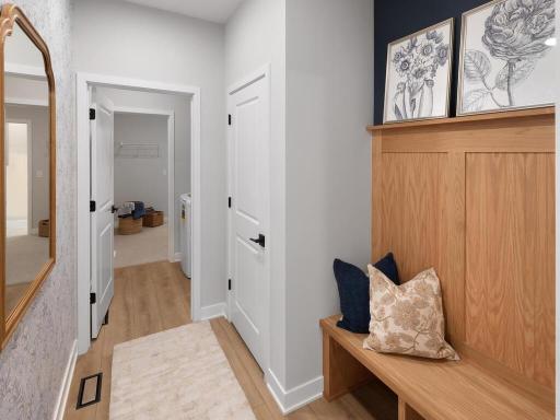 Walk in from your garage into the mudroom where a boot bench and closet await.
