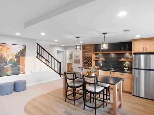 Lower-level entertaining area do not disappoint, Full sink and great storage make hosting simplified.