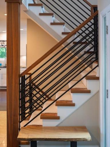 Custom iron & wood staircase is peice of art