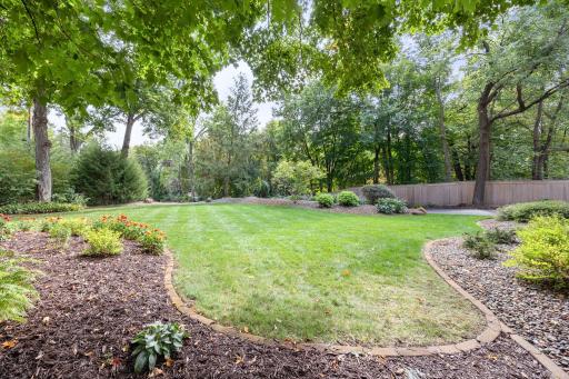 Beautifully manicured lawn with undulating curbing