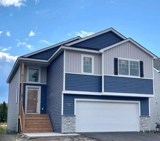 3214 Kady Ave NE- New Construction Home will be ready for move-in on 10/21/2025! Highlights include a finished walkout lower level located on a Cul-De-Sac Homesite! Sod, Landscaping, & Irrigation System will be installed soon.