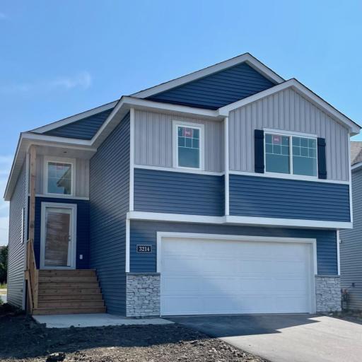 3214 Kady Ave NE- New Construction Home will be ready for move-in on 10/21/2025! Highlights include a finished walkout lower level located on a Cul-De-Sac Homesite! Sod, Landscaping, & Irrigation System will be installed soon.
