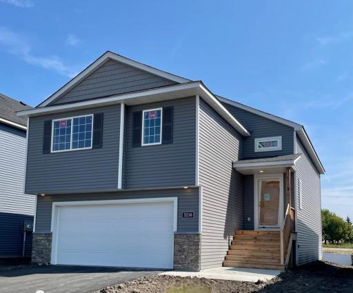 3216 Kady Ave NE- New Construction Home will be ready for move-in on 10/16/2025! Highlights include a Finished Walkout Lower Level. Front door will be painted. Sod, Landscaping, and Irrigation System will be installed soon.