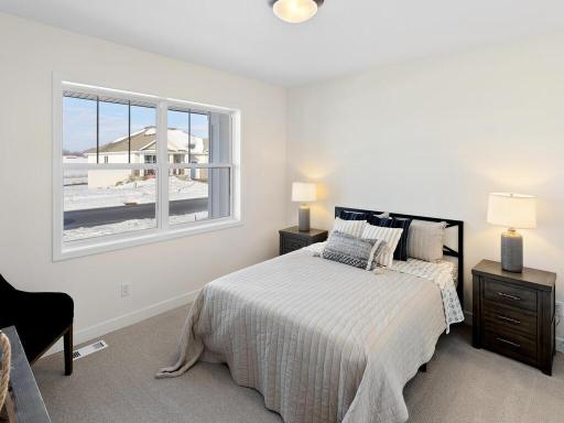 Front bedroom is opposite of the primary bedroom, offering privacy for your guests