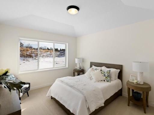 Primary bedroom has plenty of room for larger furniture and has a large walk-in closet
