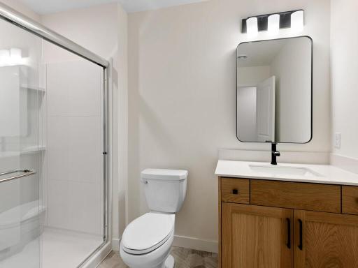 Lower level bath off the bedroom and easy access to the rec room