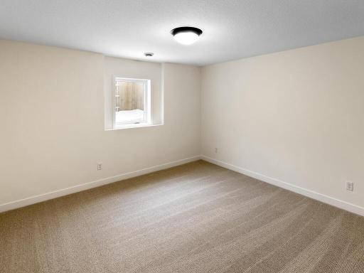 Lower-level bedroom and bath provide a private space for visitors