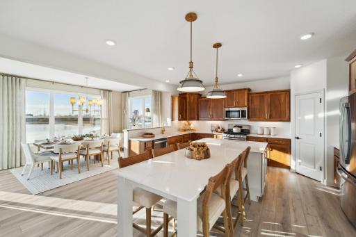 Enjoy the sunlight from your morning room while you cook lovely meals in your open concept kitchen. (Photo of model, colors and materials may vary in actual home.)