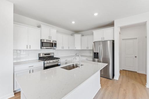 (Photo of another home, features may vary) Imagine making memorable meals here with family and friends!