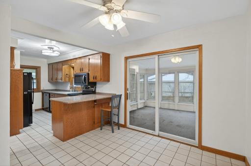 Main kitchen and dining with room to expand into the sunroom