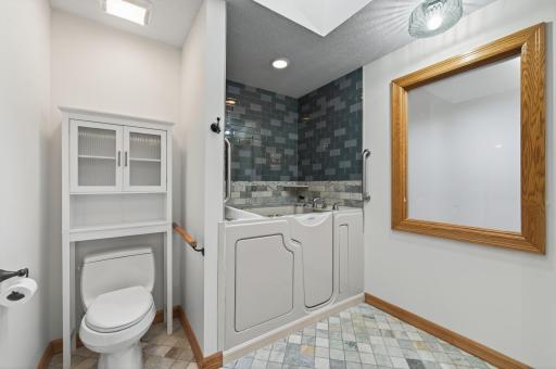 In- law suite features an accessible tub (handheld shower included)