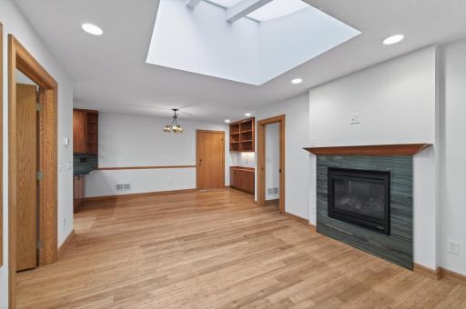 In- law suite's living room features a double- sided gas fireplace