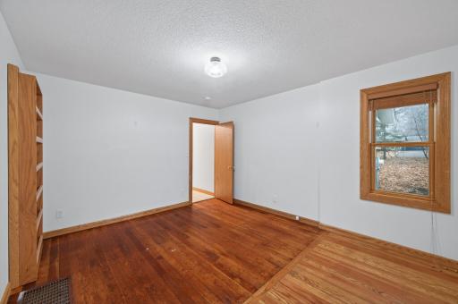 Main level flex room (featuring original 1930's hardwood floors)