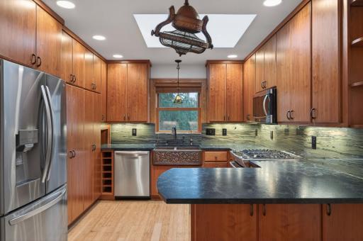 Gorgeous kitchen featuring cherry woodwork and soapstone countertops & backsplash