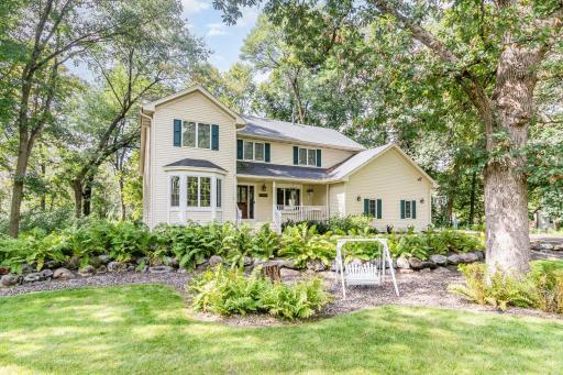 Enchanting setting on 3.3 acres of serene woods and green-space with welcoming front porch with swing. Picturesque Hanson built 'Hallmark' home framed by ferns, rock gardens, and shade trees. You are going to love this wonderful storybook home.