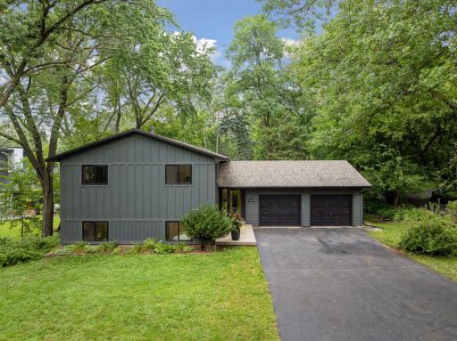 Welcome to your modern dream home surrounded by an acre of private land.