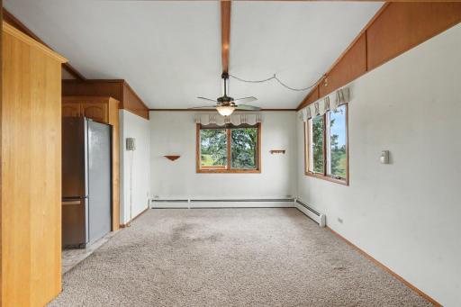 The informal dining room is bright and large enough for your dining room set. Conveniently located next to the kitchen and open to the living room. It features two large winows and a ceiling fan.