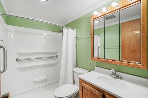 The main-level also includes a 3/4 bath with easy step-in shower with ceramic tile floors, storage cabinet and crown molding.