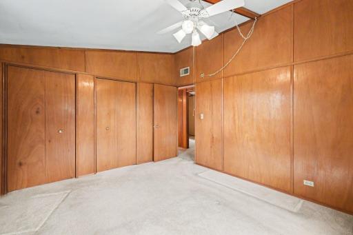 Another view of the large primary bedroom and the two spacious closets.