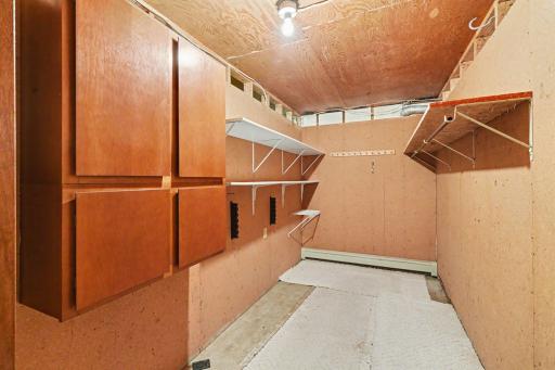 Storage galore! This home features a large 12'11'' x 6'8" storage room, clever under-stairs organization, and excellent extra cabinet space, including the deep, attached 3-car garage.
