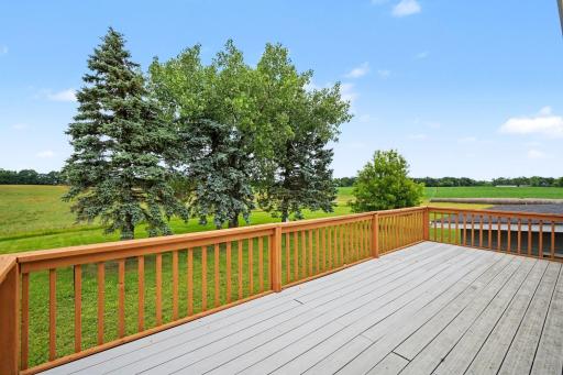 The large composite deck right off the kitchen is an entertainerâs dream. Perfect for grilling out, dining al fresco, or simply relaxing while taking in the stunning, peaceful views of your beautiful backyard oasis.