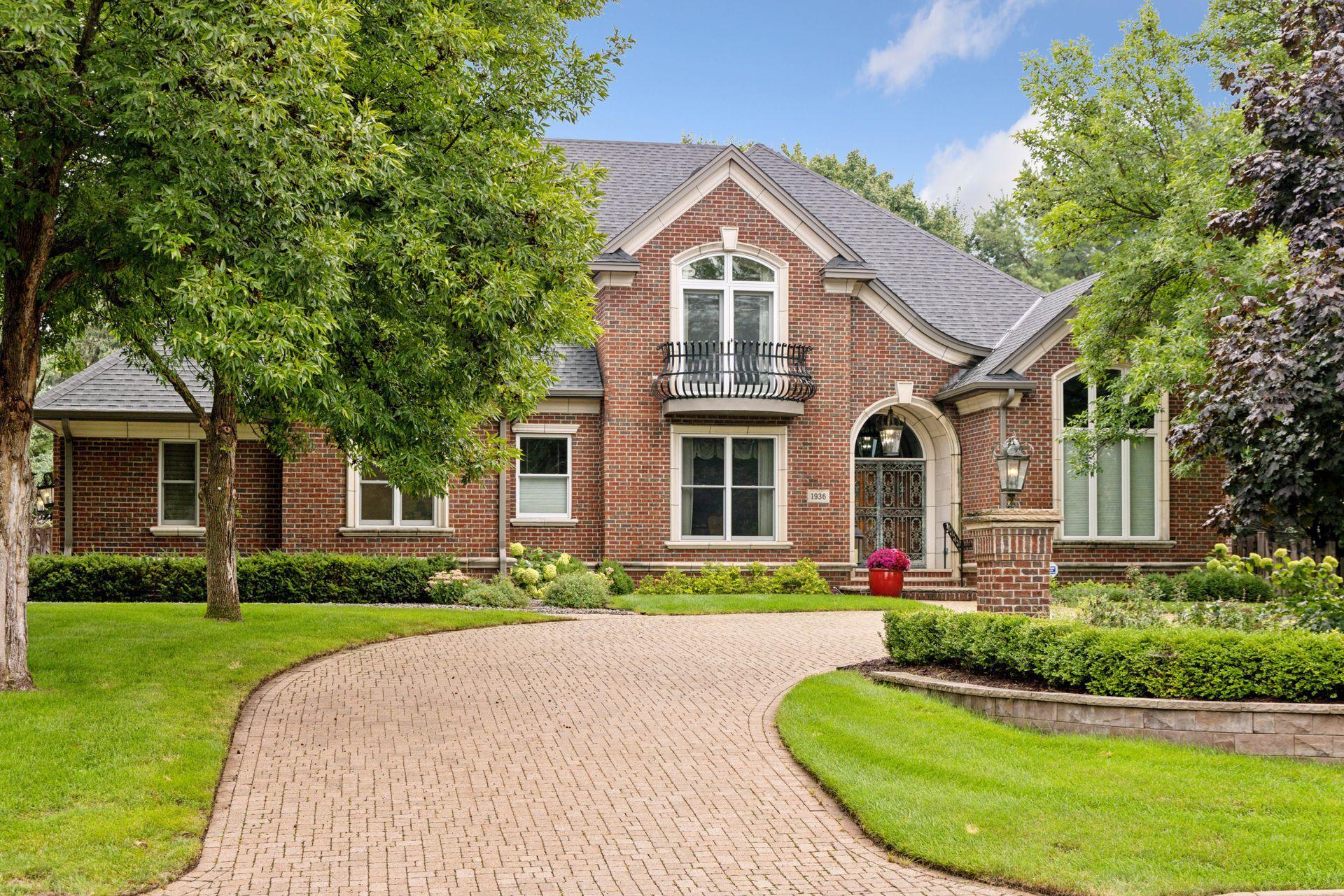 Your guests are welcomed by a paver, circle driveway