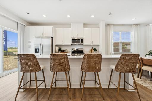(Photo of model home) Socialize while making your favorite meal!
