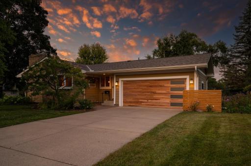 Welcome Home!
This corner lot home greets you with mature landscaping and a unique custom art sculpture that makes it stand out from the rest.