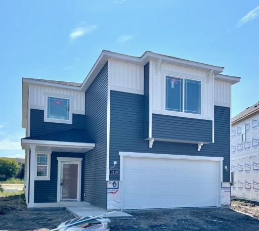 3210 Kady Ave NE- New Construction Home will be ready for move-in 10/30/25! Located on a Cul-De-Sac Homesite! Stone accents and driveway will be installed soon.
