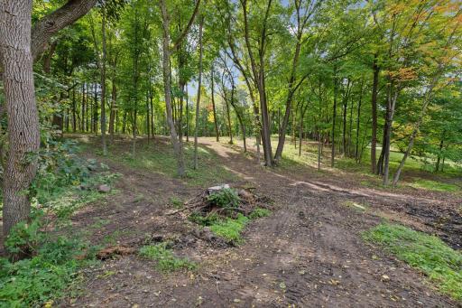 The home ensures privacy with scenic wooded views