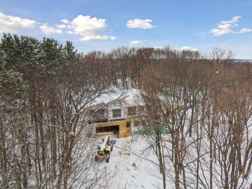 Beautiful 2.4 acre lot is nestled among mature trees, this custom home blends modern design with a private, nature-immersed setting.