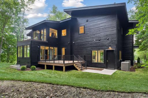 Beautiful 2.4 acre lot is nestled among mature trees, this custom home blends modern design with a private, nature-immersed setting.