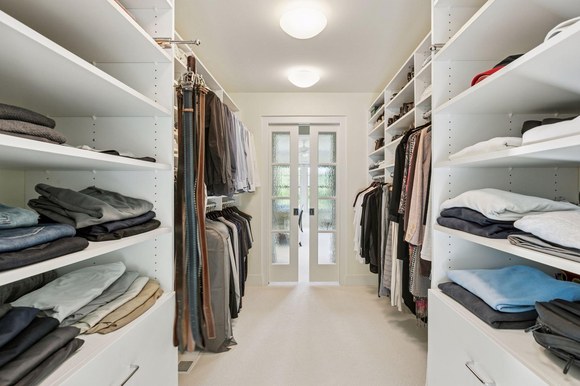 Customized pocket doors with accent glass to allow for privacy while filtering natural light.