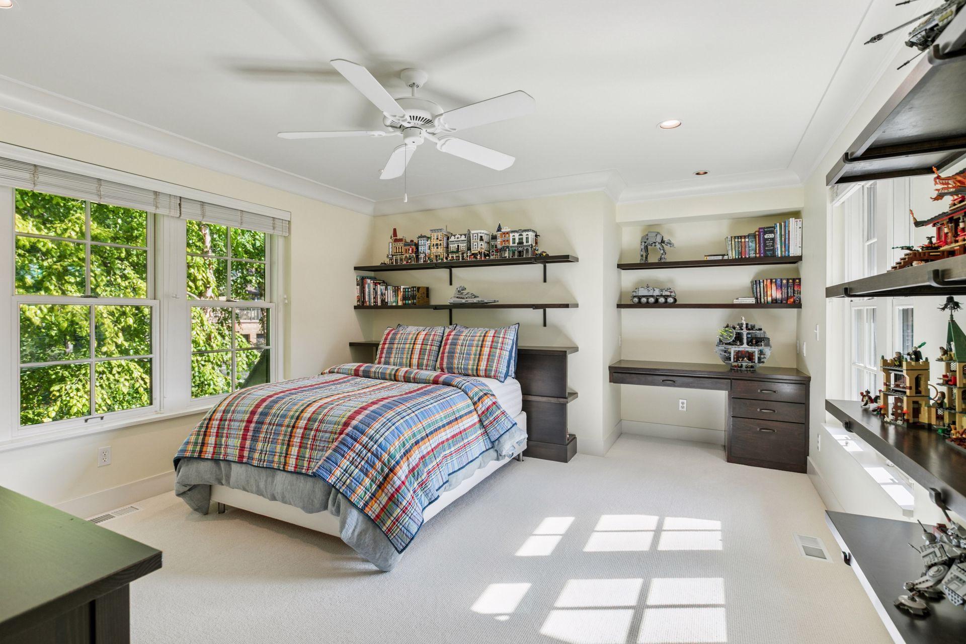 2nd bedroom has an abundance of shelving and storage plus a built-in desk. If desired, a private bath could be added beyond the desk area.