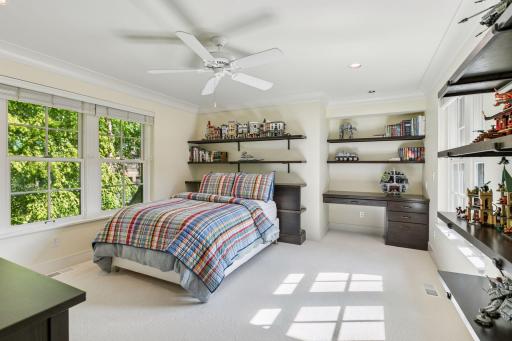 2nd bedroom has an abundance of shelving and storage plus a built-in desk. If desired, a private bath could be added beyond the desk area.