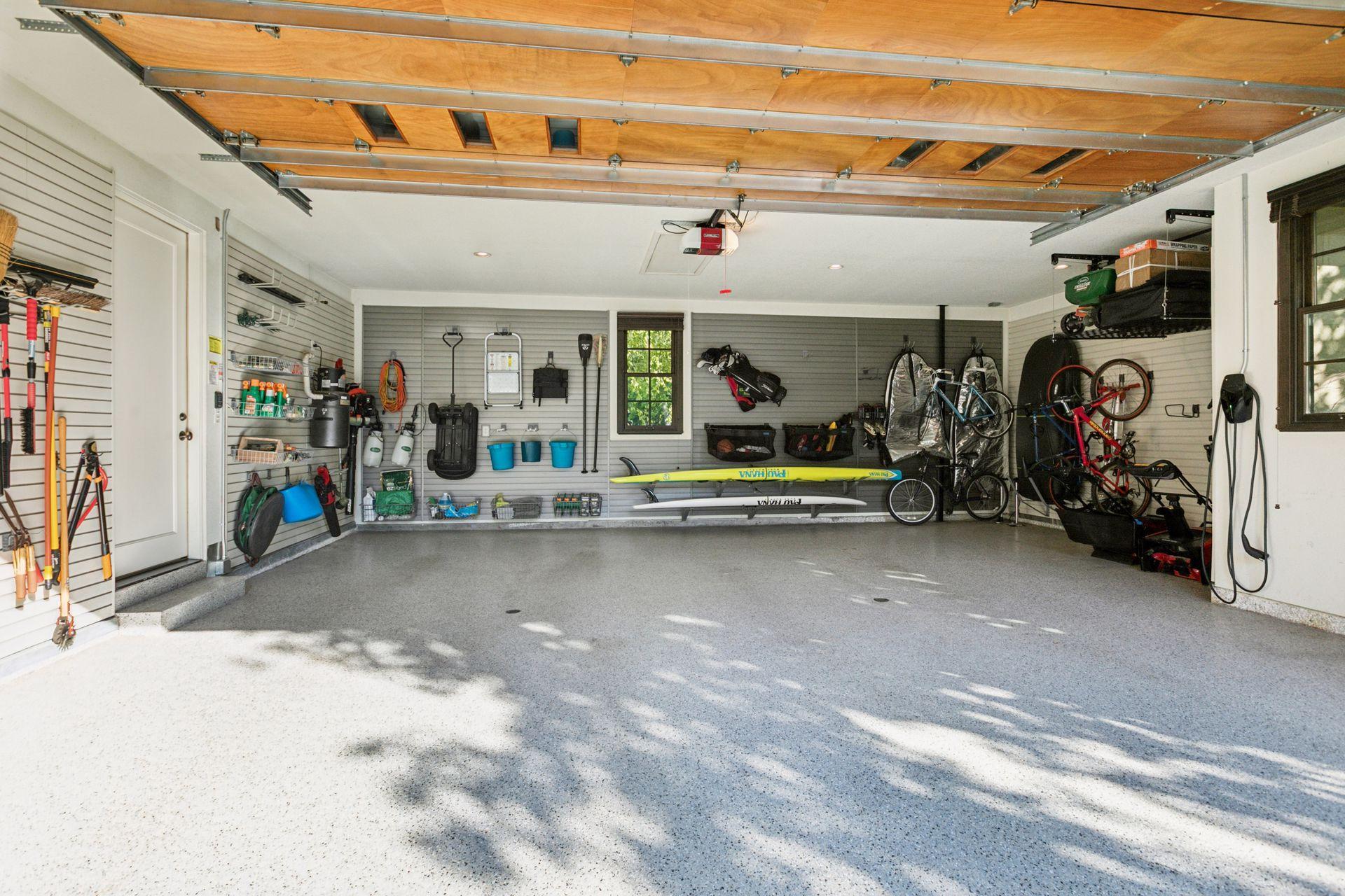 Oversized 2 car garage is insulated with a gas line plumbed, ready for a heater, if desired. Epoxy flooring, dual drains, and customized racking system for storage.