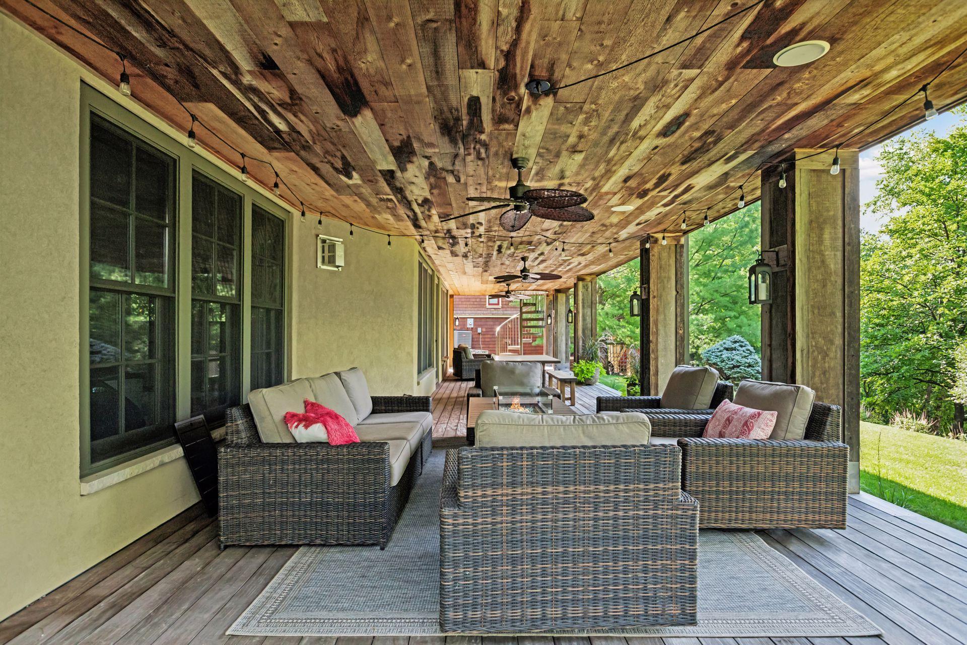 Step outside to the covered Ipe deck with ceiling fans, inset lighting, and built-in speakers.