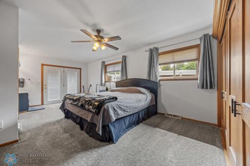 Main Floor Primary Suite- Doors to Backyard Deck