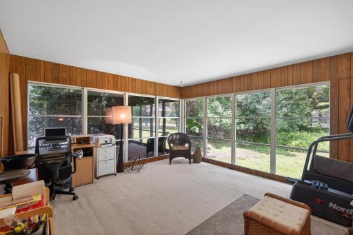 Huge sunroom just through the French doors from the living room