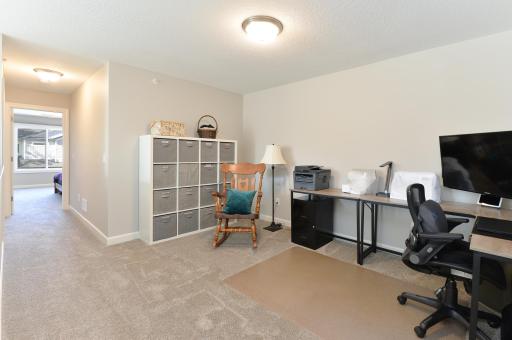 The spacious and cozy loft area offers a perfect spot for relaxing, working, or additional living space.