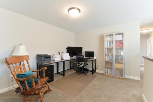 The spacious and cozy loft area offers a perfect spot for relaxing, working, or additional living space.