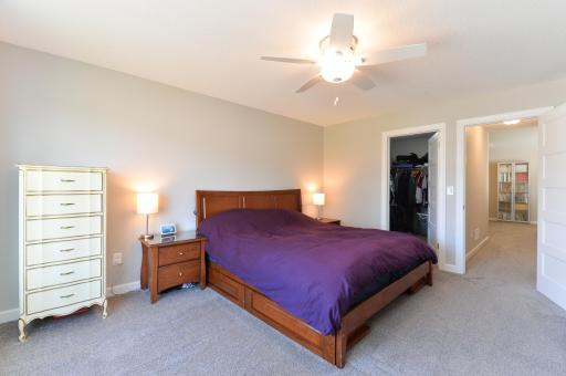 The main bedroom is one of four located on the upper level, offering a comfortable and private retreat.